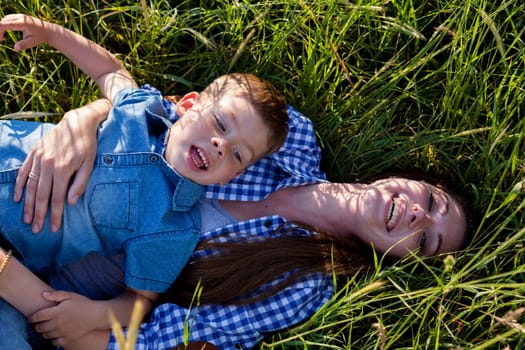 Portrait of a woman with her son on a walk in nature