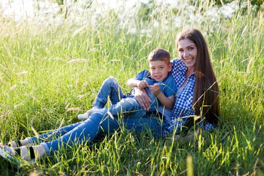 Portrait of a woman with her son on a walk in nature