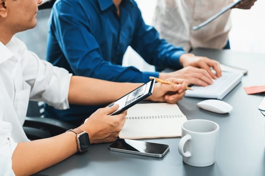 Group of diverse office worker employee working together on strategic business marketing planning in corporate office room. Positive teamwork in business workplace concept. Prudent