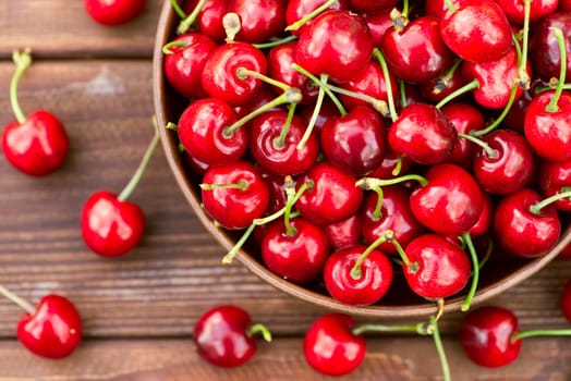 Ripe juicy berries cherries in a bowl. Freshly picked ripe cherries in a bowl