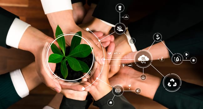 Business partnership nurturing or growing plant together with carbon icon symbolize ESG sustainable environment protection with eco technology and carbon credit solution for net zero future. Reliance