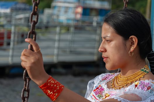 indigenous woman with a look of empowering strength holding chains looking towards the horizon. defense of women's rights. women's Day. High quality photo
