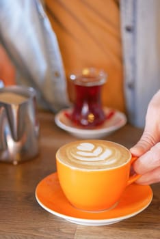 Waitress offering a cup of coffee