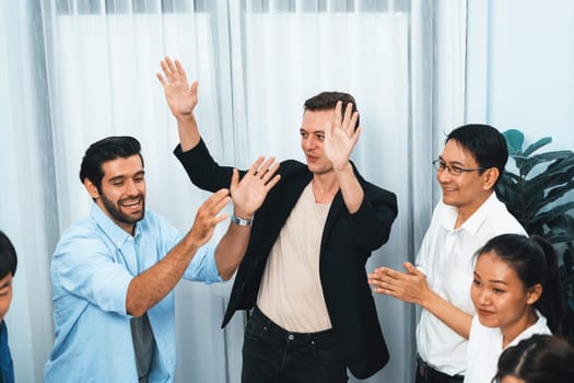 Excited and happy office worker employee celebrate after make successful strategic business marketing planning. Teamwork and positive attitude create productive and supportive workplace. Prudent