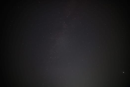 unadorned real life night sky upward view, captured with ultra-wide angle lens