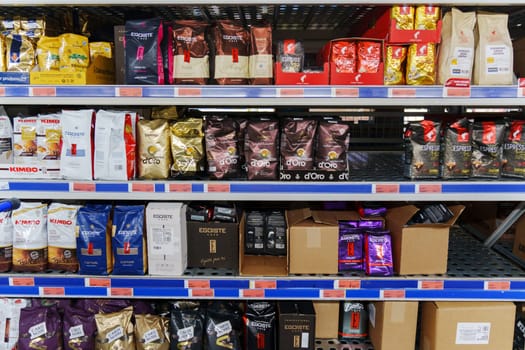 Tyumen, Russia-November 04, 2023: Grocery store shelves with coffee ground and whole beans in bags in various flavors.