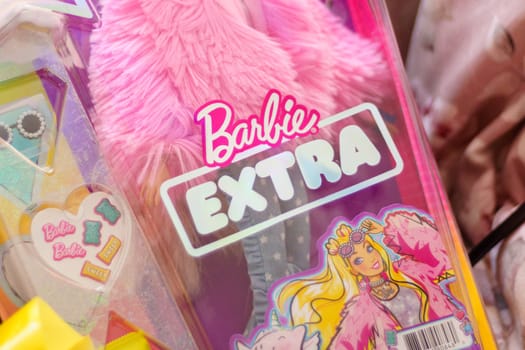 Tyumen, Russia-November 25, 2023: Barbie extra logo, produced by the American toy manufacturing company Mattel, Inc. and released to the market in March 1959