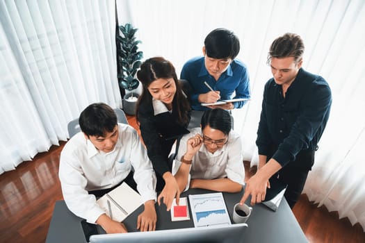 Group of diverse office worker employee working together on strategic business marketing planning in corporate office room. Positive teamwork in business workplace concept. Prudent