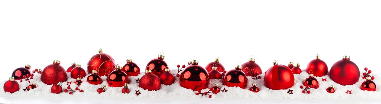 red and silver christmas balls long frame on snow isolated