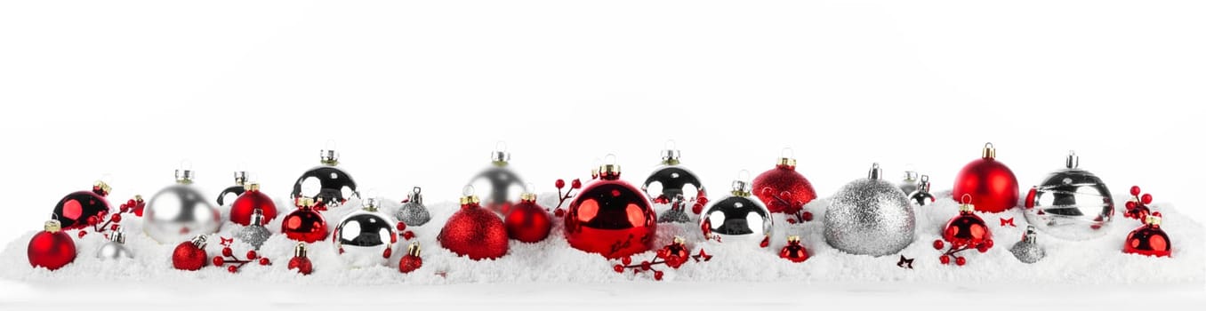 red and silver christmas balls long frame on snow isolated