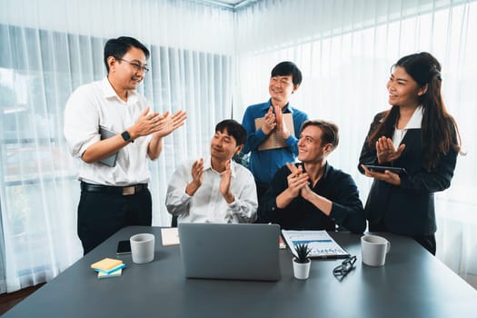 Excited and happy office worker employee celebrate after make successful strategic business marketing planning. Teamwork and positive attitude create productive and supportive workplace. Prudent