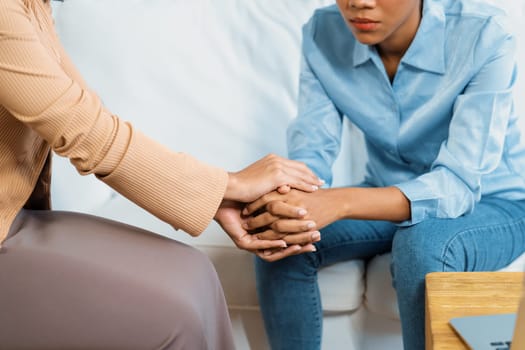 Close up shot of supportive and comforting hands for cheering up depressed patient person or stressed mind with crucial empathy