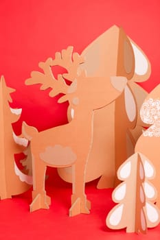 Deer from recycling cardboard. Space for text.