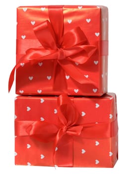 Box is wrapped in red gift wrapping and red ribbon on a white isolated background