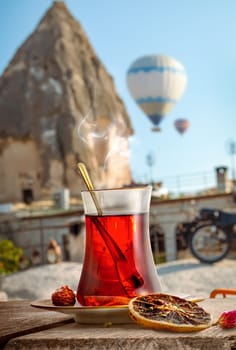 View of Cappadocia and a cup of Turkish tea