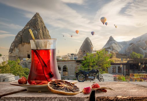 View of Cappadocia and a cup of Turkish tea