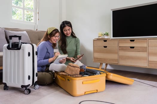 Woman and friend packing a suitcase for a new travel trip. bag and luggage for journey.