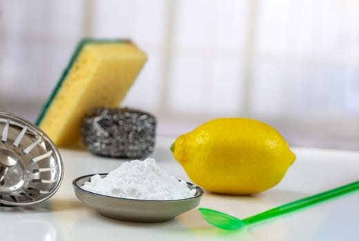 Baking soda, vinegar and cut lemons Materiel for non toic cleaning freindly household