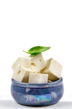 Feta cheese isolated on white background. With clipping path and full depth of field. Top view. Flat lay