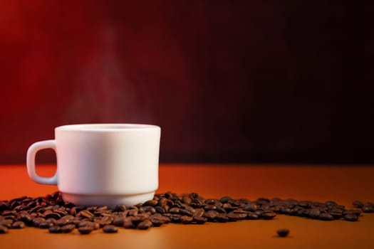 Coffee cup with smoke and freshly roasted coffee beans with copy space.