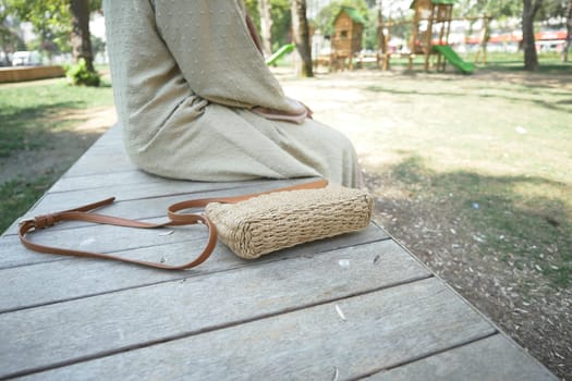 Woman left her purse on a bench in a park