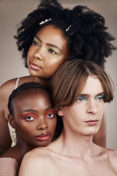 Cosmetic, beauty and young people in studio with creativity, makeup and facial art aesthetic. Lgbtq, diversity and creative man and women models with face cosmetology isolated by a brown background