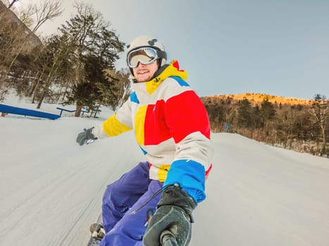 A daring man conquers snowy slopes with style, showcasing skill and thrill as he maneuvers on a snowboard, capturing the essence of winter adventure.