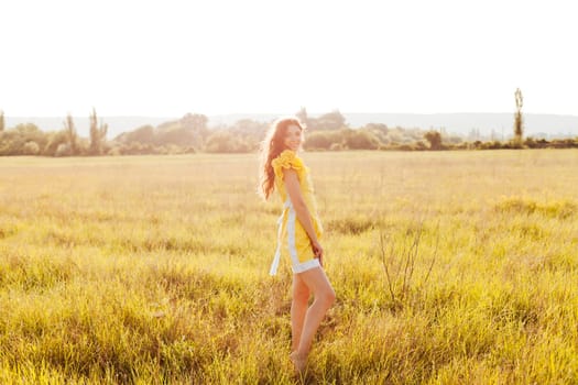 Woman in a field with flowers on a walk