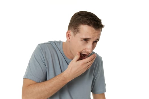 caucasian man suffers pain in throat and coughing on white background