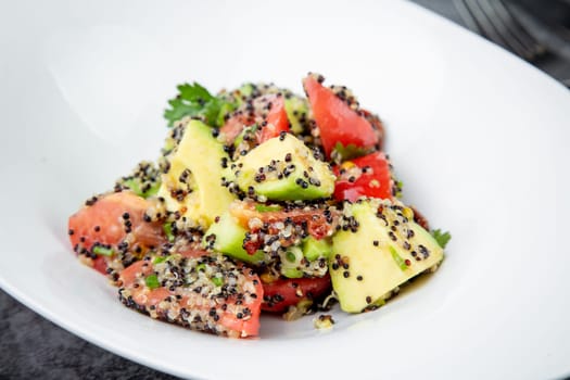 salad of tomatoes, zucchini, grated garlic with a lot of sesame seeds