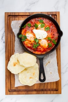 beetroot borscht with sour cream and parsley in a frying pan