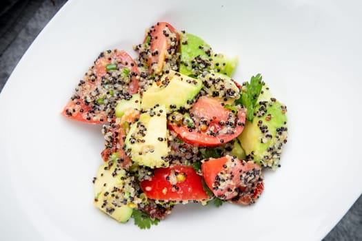 salad of tomatoes, zucchini, grated garlic with a lot of sesame seeds