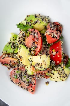 salad of tomatoes, zucchini, grated garlic with a lot of sesame seeds