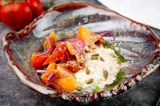 dish of baked persimmons, colored peppers, rice and seeds