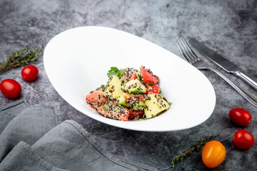 salad of tomatoes, zucchini, grated garlic with a lot of sesame seeds