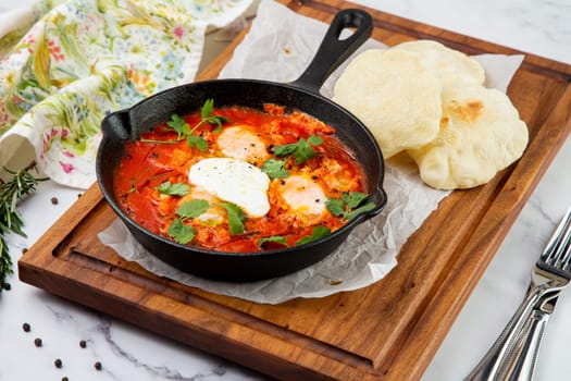 beetroot borscht with sour cream and parsley in a frying pan