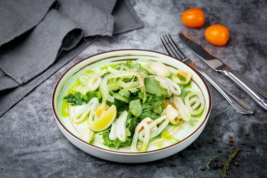 salad with arugula, parsley, lime and squid rings