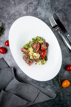 salad of tomatoes, zucchini, grated garlic with a lot of sesame seeds