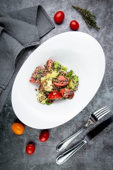 salad of tomatoes, zucchini, grated garlic with a lot of sesame seeds