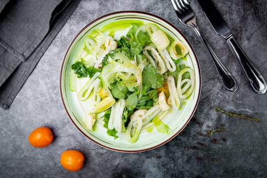 salad with arugula, parsley, lime and squid rings