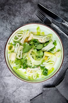 salad with arugula, parsley, lime and squid rings