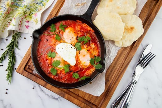 beetroot borscht with sour cream and parsley in a frying pan