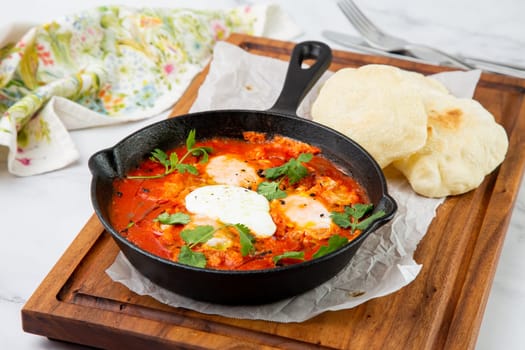 beetroot borscht with sour cream and parsley in a frying pan