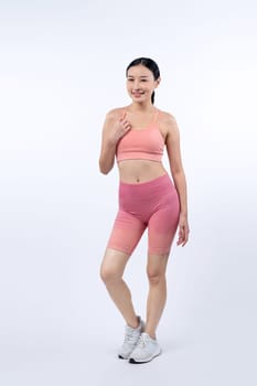 Full body asian woman in sportswear portrait, smiling and posing cheerful gesture. Workout training with attractive girl engage in her pursuit of healthy lifestyle. Isolated background Vigorous