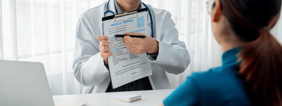 Patient attend doctor's appointment at clinic or hospital office, discussing medical treatment options and explaining examination results or medical record about sickness. Panorama Rigid