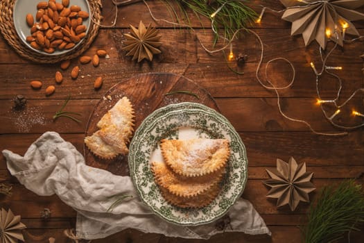 A crescent-shaped pastry whose filling is made of eggs and almonds wrapped in crispy dough, cut in an artisanal way and sprinkled with sugar.