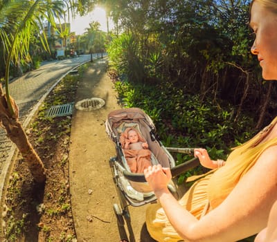 Mom strolls with her newborn in a cozy stroller a heartwarming moment of motherhood.