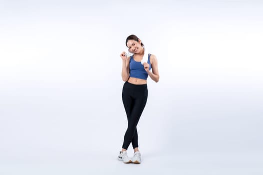 Full body asian woman in sportswear portrait, smiling and posing cheerful gesture. Workout training with attractive girl engage in her pursuit of healthy lifestyle. Isolated background Vigorous