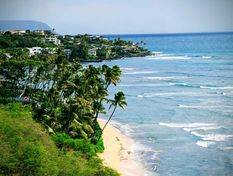 A scenic view from Diamond Head Lookout in Honolulu, Hawaii, with the ocean and the coastline in the background.