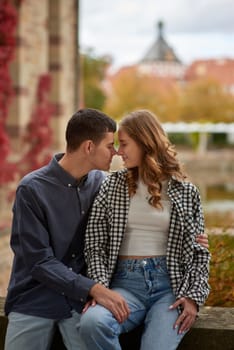 Young Cute Female Hugs Boyfriend. In Autumn Outdoor. Lovers Walking in Park. Attractive Funny Couple. Lovestory in Forest. Man and Woman. Cute Lovers in the Park. Family Concept. Happy Couple.